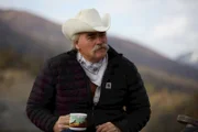 Medium shot of Marty Raney leaning forward, holding his coffee mug.