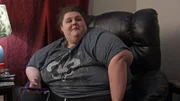 Sarah looks at her phone.