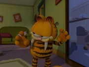 Garfield, als Katzilla verkleidet, erschreckt etliche Nachbarn fast zu Tode.