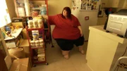 Erica goes through her food stash in the kitchen.