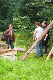 Gabe Brown, Noah Brown, and Matt Brown by the cabin.