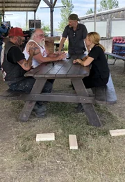 Mariana van Zeller (seated R) talking to subjects about motorcycle gangs.