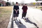 Kandi and Brandi walk the dog.