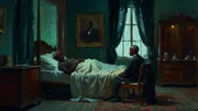 Illustration eines Mannes, der im Bett liegt, während ein anderer Mann auf einem Stuhl neben ihm sitzt