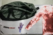A bloody knife, glove, and shirt reveal a violent murder within the Locascio family.