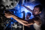 Mobile, AL - REENACTMENT - Crew tries to fix a burst pipe in the pump room aboard the USS Silversides. Actors L to R: Alex Sturdivant and Zach Hill. (Parallax Film Productions Inc/Sean F. White)