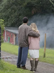 Young Karl and Cindy Best look at the destroyed farm.