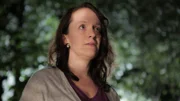 Lori looks into the distance.