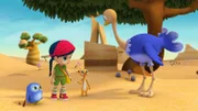 Wissper hat Strauß Ritchie gerufen. Er soll Erdmännchen Monty helfen, die unterm Sand vergrabenen Früchte für die Überraschungsparty wiederzufinden.