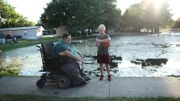 John walking at a pond