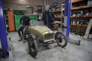 Tim and Fuzz pose beside the pre-restored Cannon "Goldfinger" after the pickup in the workshop.