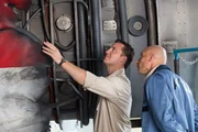 ATSB Investigator Simon Grummett (played by Justin Mader) points out some critical damage deep in the engine from Qantas Flight 32.