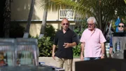 Host Anthony Melchiorri, George, William walk along pool deck, as seen on Travel Channel's Hotel Impossible.