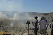 WIKIEUP, AZ - Machine gun fire erupts as the Big Sandy Shoot commences (Photo Credit: National Geographic/Seth Nejame)