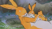 Großer brauner Hase und kleiner brauner Hase freuen sich zusammen.