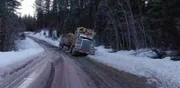 The "Mud Mountain Truckers" and their vehicle sink into the morass.