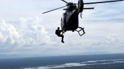Bear Grylls hanging out of a helicopter.