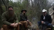 L-R: Matt, Misty and Marty Raney sit outside of their tent.