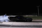 Big Chief performs a burnout before his race against Daddy Dave