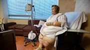 Zsalynn sitting on a hospital chair while recovering after surgery.