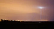 Beam of light glowing in rural landscape