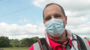 Dr Jonny Scrimshaw giving an IV to camera on patient's condition and transfer to hospital