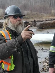 Tony Beets looking at the dredge.