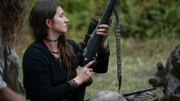 Bird Brown holding gun up.