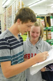 Broderick and his sister check their list.