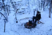 Krin Nelson making a fire.
