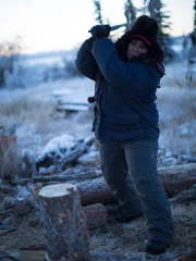 Susan chops wood.