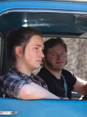 Gabe and Bird Brown in the cab of the farm truck.