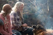 Ami and Billy Brown play with their dog Mr. Cupcake.