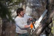 Gabe clears land for his new cabin site.
