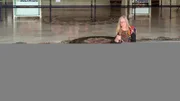 Jenny meditates with prayer beads in a Hare Krishna temple in India.