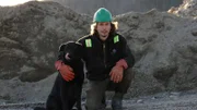 A portrait of Parker Schnabel and his dog Dozer.