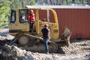 Billy, Bear, and Gabe prepare to move Bear’s conex container up the mountain.