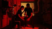 Astronauts in red room.