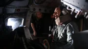 Astronaut inside capsule.