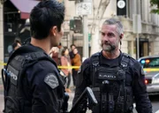 L-R: Officer Victor Tan (David Lim), Sergeant David 'Deacon' Kay (Jay Harrington)