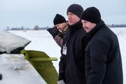 Bob Benzon (played by Jonathon Shatsky) observes the wreckage of Continental Airlines Flight 1713, joined by Richard Rodriguez (played by Adam Gaudreau) and a photographer (played by a background actor).
