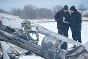 Richard Rodriguez (played by Adam Gaudreau) and Bob Benzon (played by Jonathon Shatsky) look over the weather report in an effort to understand the events that led Continental Airlines flight 1713 to crash.