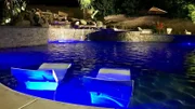 At night the Tiemann pool takes on another life with ample lighting accents, like that on the Baja shelf, or out by the water feature.