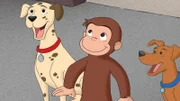 Curious George next to two dogs.