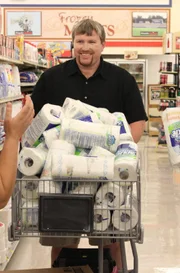 Chasity and April load up Wesley with paper towels.