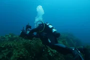 JS filming underwater (back to camera), air bubbles