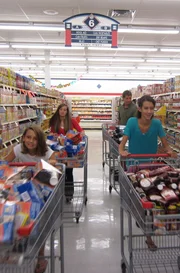 Haley and her family push carts.