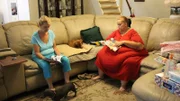 Tara and her mom sitting in the living room.