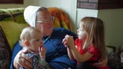 Mary playing with her grandkids.