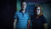 Amy and Adam pose in the basement.